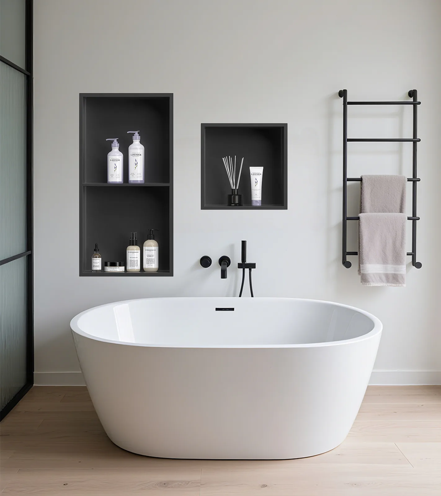 Two matte black niches installed beside a freestanding tub