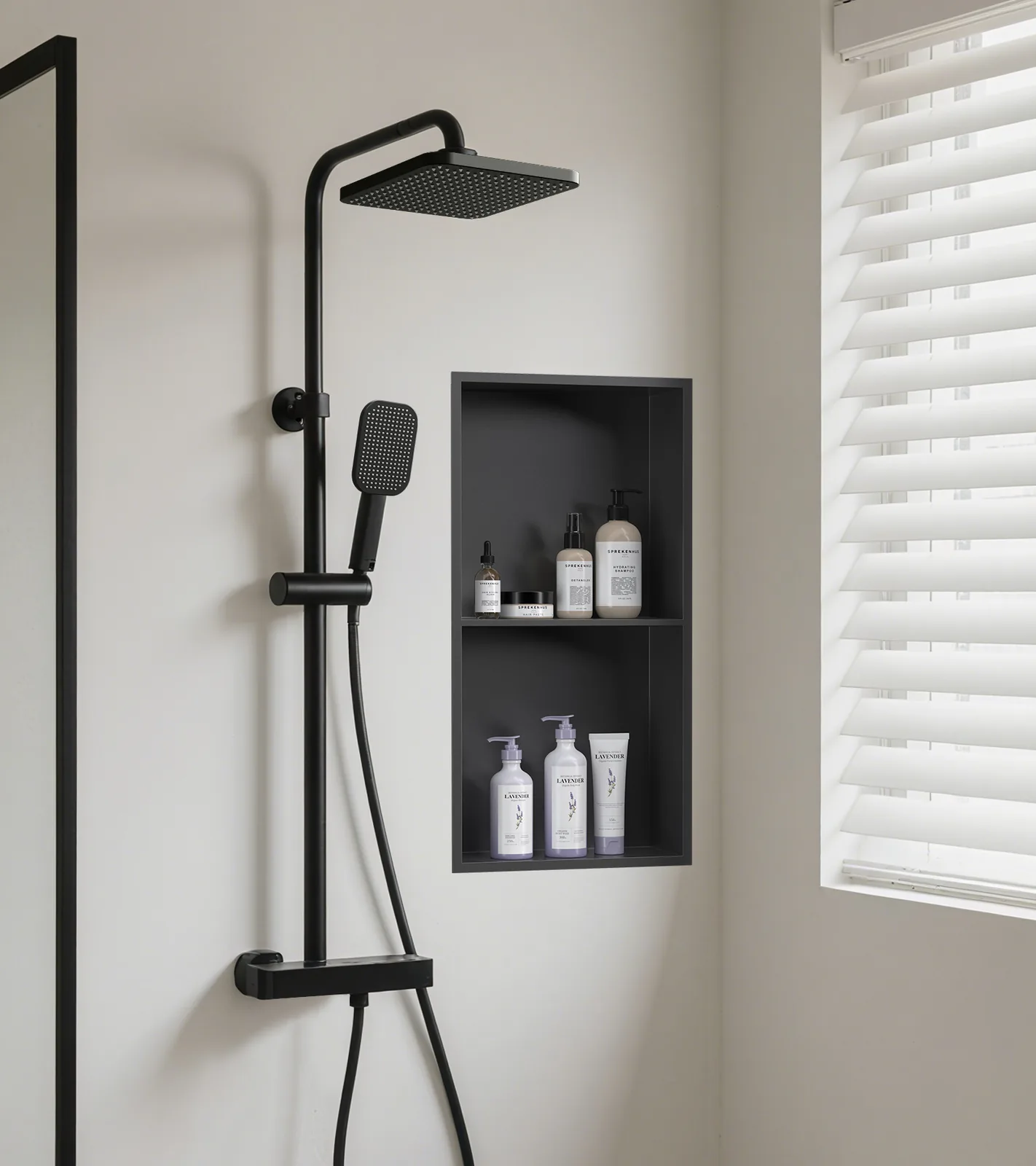 Matte black double niche installed in a shower wall